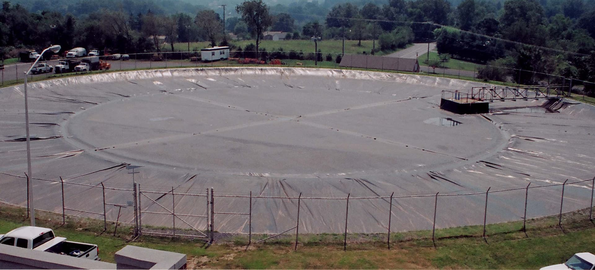 Overview of Staunton's covered reservoir, perimeter fence and access walkway