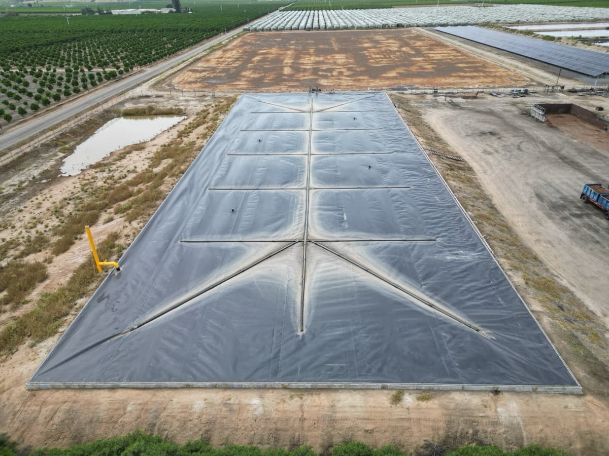 EFI fabricated cover with access ports on a covered lagoon